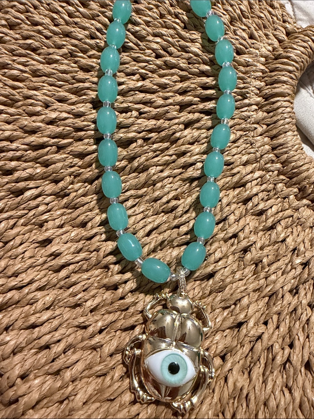 Turquoise Beaded Necklace with Gold Scarab Eye Pendant